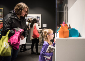 A young NMWA visitor experiences Laure Tixier’s Plaid Houses (Maquettes) (2005–11) during the 2019 Women’s March on Washington Free Community Day; Photo by Kevin Allen